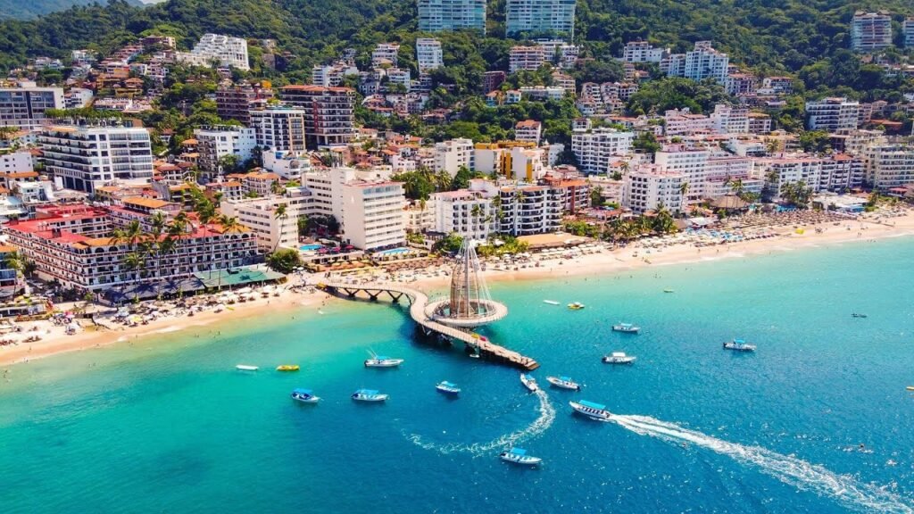 Puerto Vallarta beach side area and hotels, boats in rivers